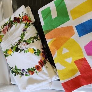 Pair of Never worn love and peace t shirts